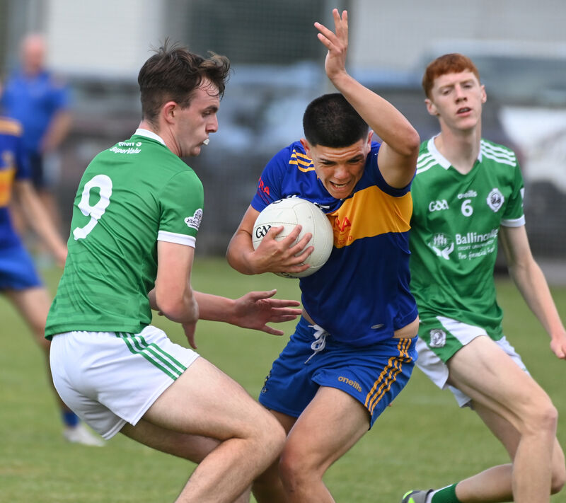 Carrigaline's Ollie Lynch holds onto the ball from Ballincollig's Conor Cogan. Picture: Eddie O'Hare Carrigaline's Ollie Lynch holds onto the ball from Ballincollig's Conor Cogan. Picture: Eddie O'Hare
