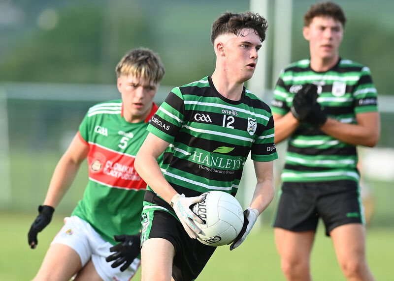 Douglas's Tomás Reddington slips past Shay O'Donovan of Clonakilty. Picture: Martin Walsh Douglas's Tomás Reddington slips past Shay O'Donovan of Clonakilty. Picture: Martin Walsh