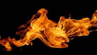 abstract fire flame isolated black background. concept of effect texture ablaze, graphic design bonfire, blaze at night