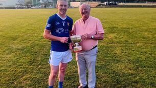<p>Chairman of the Carrigdhoun Division, Myles Barry, presents Ballyinhassig's captain Micheal Sheehan with the Junior A Hurling Trophy as league champions for 2026, following their victory over Courcey Rovers </p> <p>Chairman of the Carrigdhoun Division, Myles Barry, presents Ballyinhassig's captain Micheal Sheehan with the Junior A Hurling Trophy as league champions for 2026, following their victory over Courcey Rovers </p>