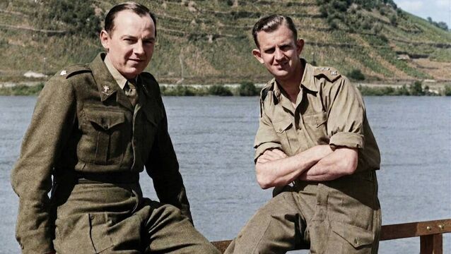 <p>Fr Charles Hussey (right) and a fellow chaplain on the Rhine in 1945</p>