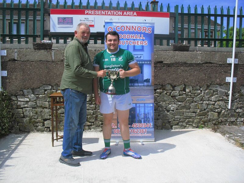 Seandún chairman Mick Buckley presenting the Cormac O'Connor Butchers & Foodhall Croabh Rua Cup to St Vincent's captain Darren Fitzgerald at Ballinlough. Seandún chairman Mick Buckley presenting the Cormac O'Connor Butchers & Foodhall Croabh Rua Cup to St Vincent's captain Darren Fitzgerald at Ballinlough.