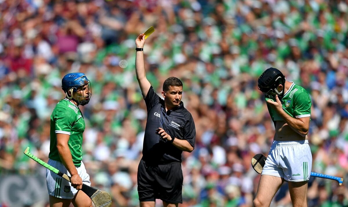Referee Colm Lyons shows a yellow card to Mike Casey of Limerick. Picture: Stephen McCarthy/Sportsfile Referee Colm Lyons shows a yellow card to Mike Casey of Limerick. Picture: Stephen McCarthy/Sportsfile
