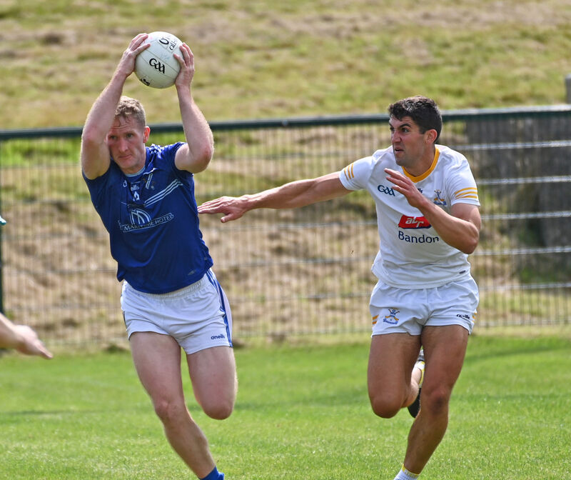 Bantry Blues' Ruairí Deane goes past Bandon's Peter Murphy. Picture: Eddie O'Hare