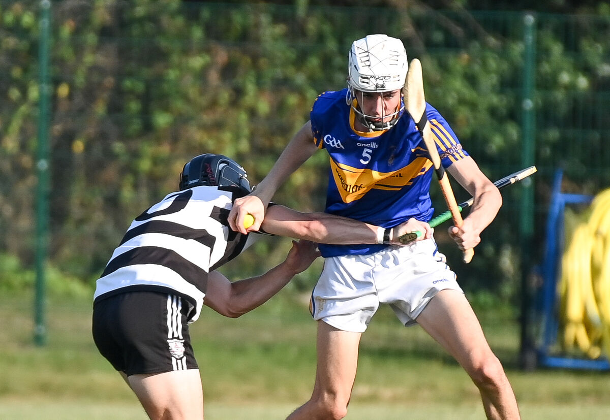  Midleton's Liam Walsh tackles Carrigtwohill's Cillian Rooney. Picture: David Keane.