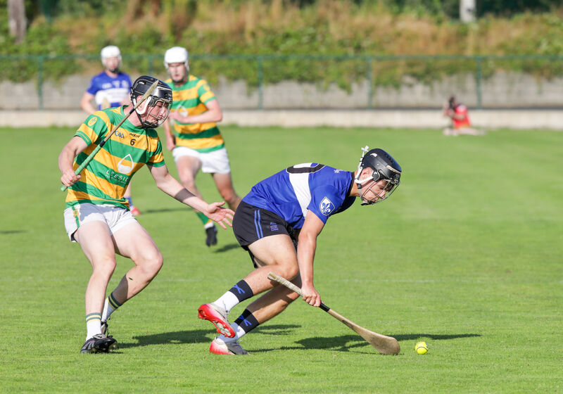 Sars' Alex Maher goes to pick up the sliotar ahead of Blackrock's Dylan Norberg. Picture: David Creedon
