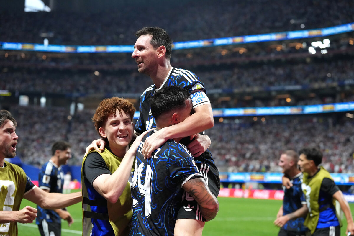 Argentina's Lionel Messi celebrates the side's second goal of the game against England, with team-mates.