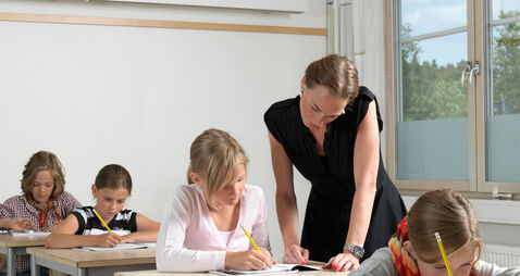 Teacher and students in a classroom