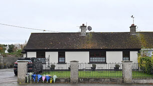 <p> Flowers at the residence on Rockview Terrace, Doneraile, where the body of postman Barry Daly was discovered. Picture: Dan Linehan.</p>