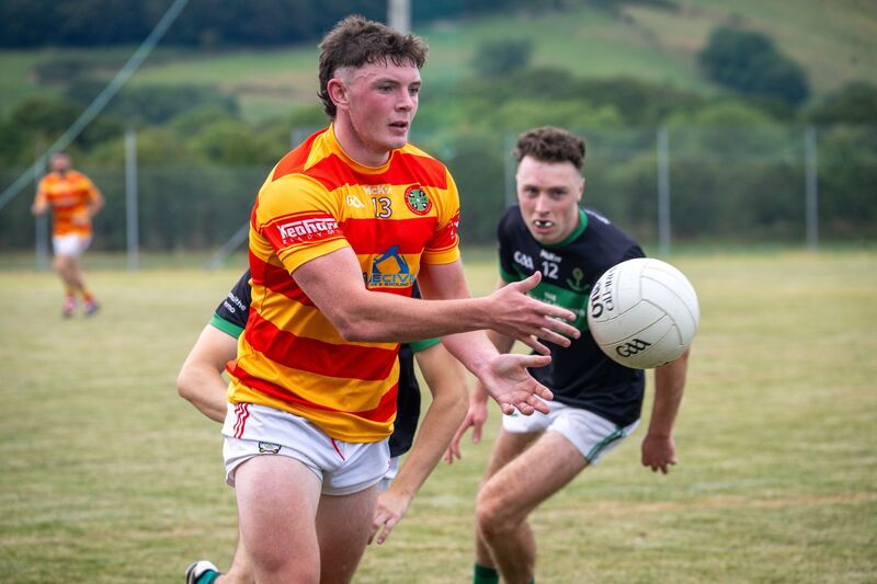 Newcestown’s Daire McAree makes a pass while Nemo Rangers’ Barry Cripps has eyes on the ball. Picture: Chani Anderson Newcestown’s Daire McAree makes a pass while Nemo Rangers’ Barry Cripps has eyes on the ball. Picture: Chani Anderson