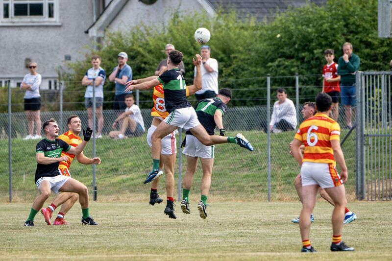 Nemo Rangers’ Barry Cripps and Newcestown’s Seán O’Donovan battle for possession. Picture: Chani Anderson