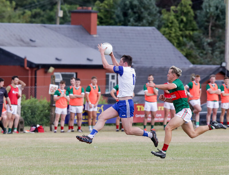 Knocknagree's Eoghan McSweeney grabs the dropping ball ahead of Clonakilty's Dylan Harrington. Picture: David Creedon Knocknagree's Eoghan McSweeney grabs the dropping ball ahead of Clonakilty's Dylan Harrington. Picture: David Creedon