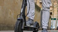 Legs on an electric scooter