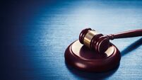 judge gavel on a blue wooden background