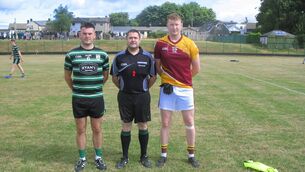 <p>Referee David Daly accompanied by captains Joe Cremin (Douglas) and Ruairí Dennehy (Whitechurch) </p> <p>Referee David Daly accompanied by captains Joe Cremin (Douglas) and Ruairí Dennehy (Whitechurch) </p>