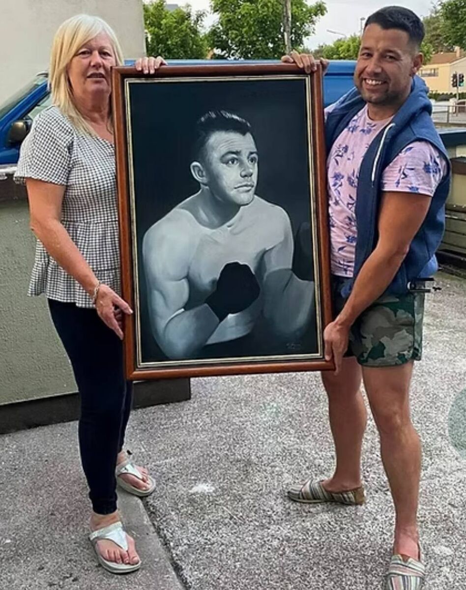 Danny Nagle's daughter Catherine Ahern and grandson Danny O'Donovan. with a restored oil on canvas portrait of Danny Nagle. MOB