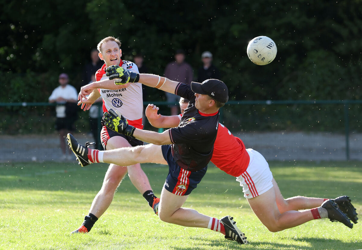  Derek Tobin and Darren Daly, O'Donovan Rossa, deny Barry O'Connor a goal for Newmarket. Picture: Jim Coughlan.