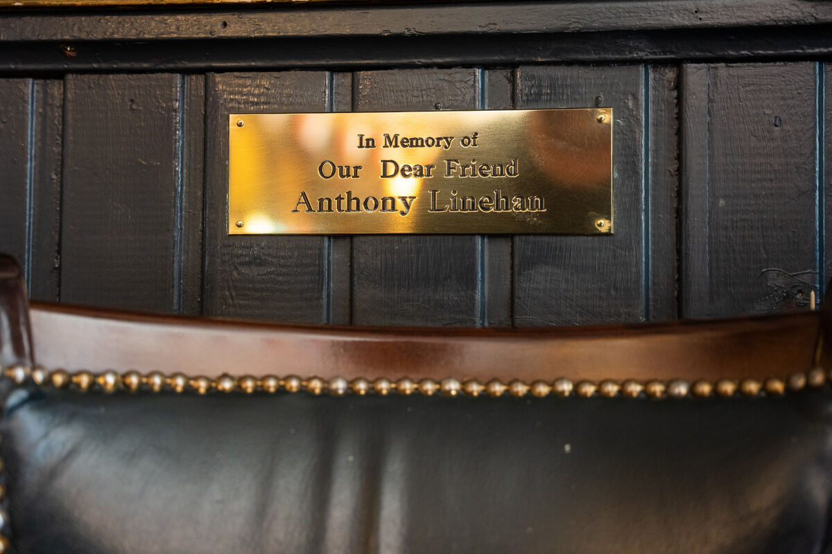 A plaque placed over the seat where regular customer Anthony Linehan sat before his passing A plaque placed over the seat where regular customer Anthony Linehan sat before his passing