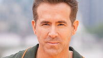 Ryan Reynolds walks the floor at Comic-Con dressed as Deadpool