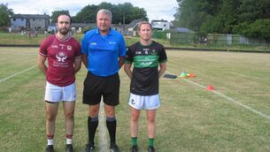 <p>Referee Cormac Dineen accompanied by captains Conor Philpott (Bishopstown) and Eric Dilloughrey (Nemo Rangers) </p>