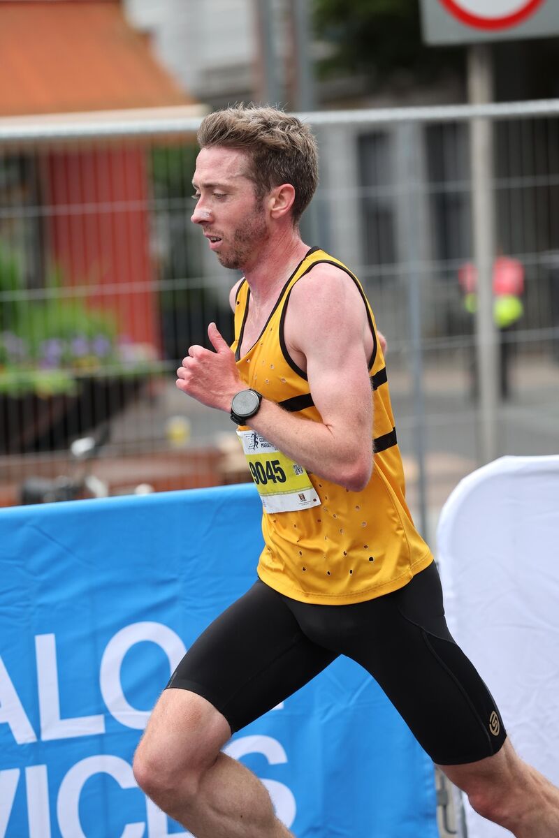 Half Marathon winner, Ryan Creech, on the Grand Parade just before the finish line. Half Marathon winner, Ryan Creech, on the Grand Parade just before the finish line.