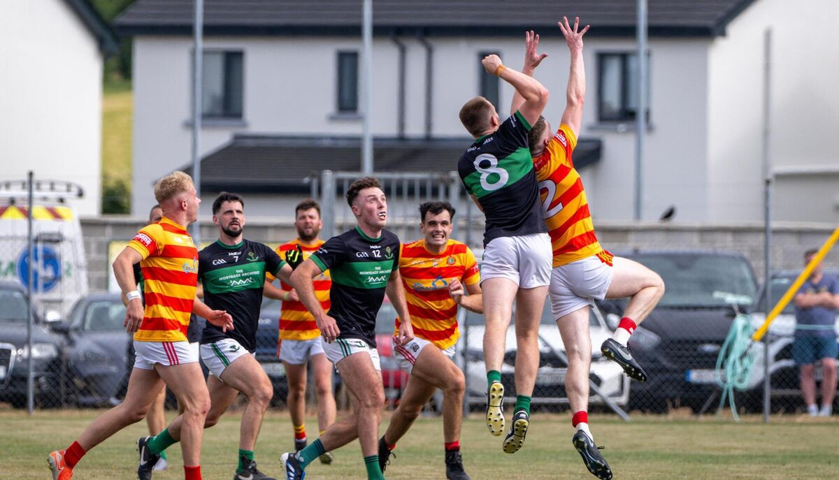 Nemo Rangers' Alan O’ Donovan and Newcestown’s David Buckley in the air. Picture: Chani Anderson Nemo Rangers' Alan O’ Donovan and Newcestown’s David Buckley in the air. Picture: Chani Anderson