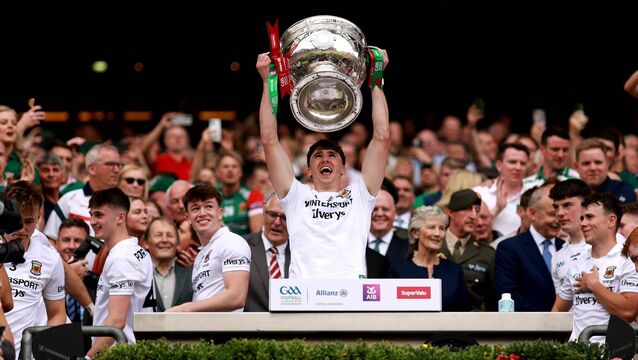 <p>Mayo’s Sam Callinan lifts the Sam Maguire cup on Sunday after winning the All-Ireland Football Championship. Picture: INPHO/James Crombie</p>