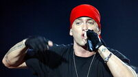 Eminem to auction more than 100 pairs of his signed trainers