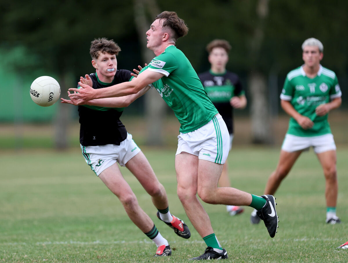 Conor Cogan of Ballincollig lays off the ball against Christopher Randles of Nemo Rangers. Picture: Jim Coughlan Conor Cogan of Ballincollig lays off the ball against Christopher Randles of Nemo Rangers. Picture: Jim Coughlan