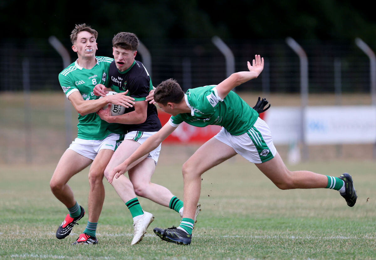 Brian Cronin and Jack Costello of Ballincollig challenge Michael Scott of Nemo Rangers. Picture: Jim Coughlan Brian Cronin and Jack Costello of Ballincollig challenge Michael Scott of Nemo Rangers. Picture: Jim Coughlan
