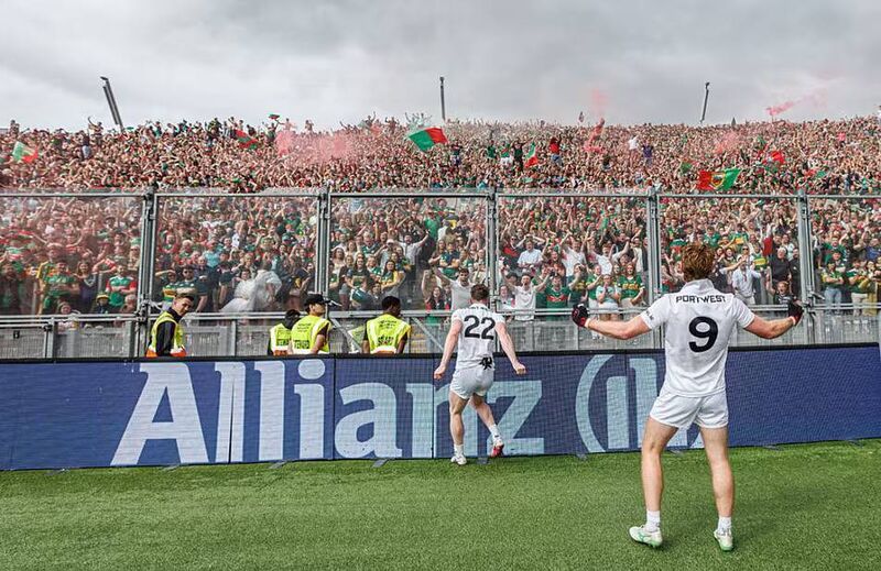 Celebrating Mayo players and fans. Picture: James Crombie/INPHO