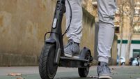 Legs on an electric scooter