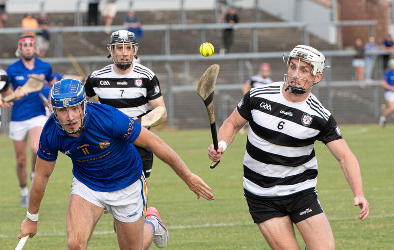 Midleton's Tommy O'Connell tries to control the ball, under pressure from St Finbarr's Conor McCarthy. Picture: Howard Crowdy Midleton's Tommy O'Connell tries to control the ball, under pressure from St Finbarr's Conor McCarthy. Picture: Howard Crowdy