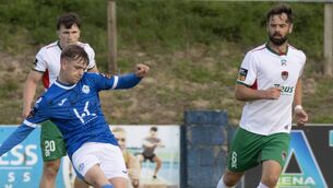 <p>Cork City's Greg Bolger chases back as Ciaron Harkin sets up a Harps attack. (North West newspix)</p>