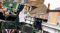 Nick Cave And The Bad Seeds perform surprise gig on roof of Brighton record shop