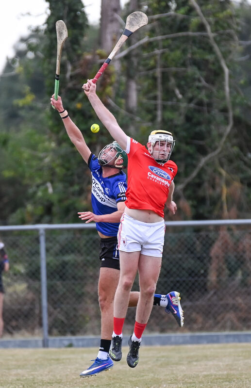  Sarsfields' Cillian Roche and Charleville's David Forde compete in the air. Picture: David Keane