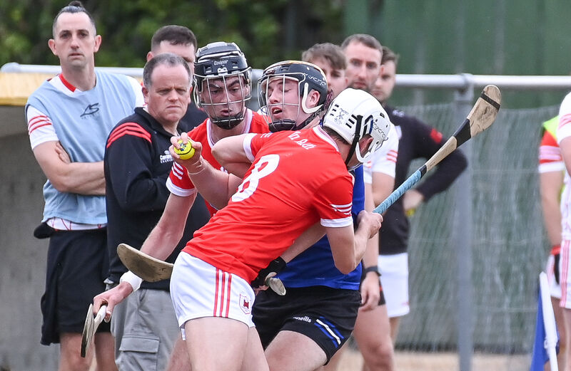  Sarsfields' Daniel Hogan is tackled by Charleville's Cathal O'Carroll and Robert Carroll during their Premier SHC clash at Castletownroche. Picture: David Keane