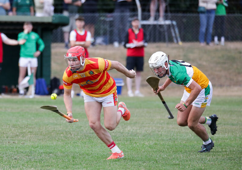 Newcestown's Richard O'Sullivan takes on Bride Rovers' Cormac Barry. Picture: David Creedon