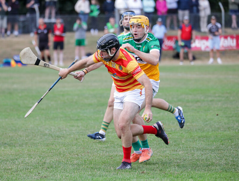 Newcestown's Colm Dinneen tries to get away from Bride Rovers' Cillian Tobin. Picture: David Creedon