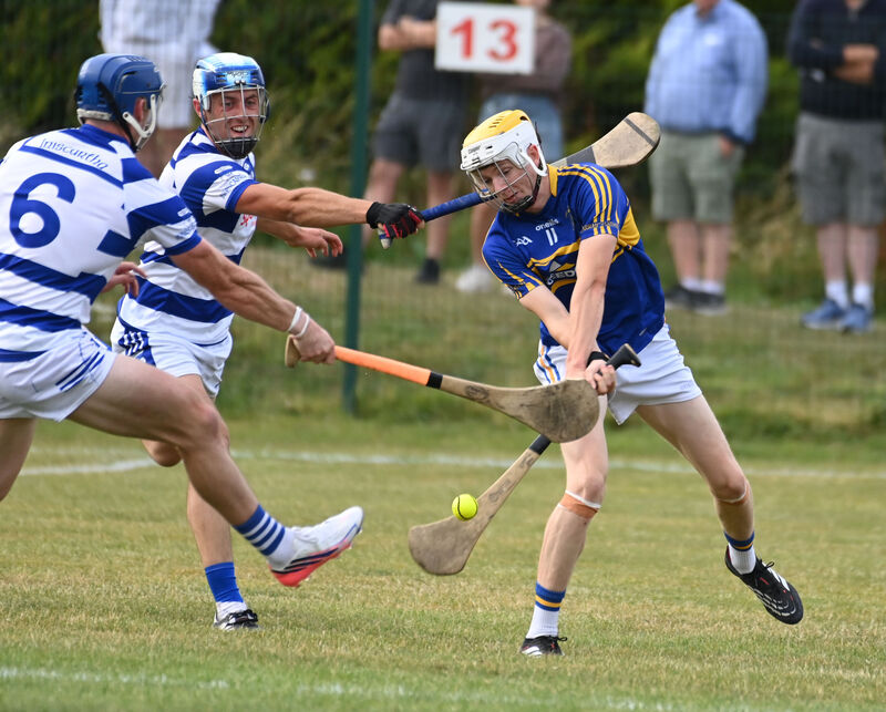 Carrigtwohill's Matthew Barrett shoots from Inniscarra's Con O'Leary and Sean O'Donoghue. Picture: Eddie O'Hare Carrigtwohill's Matthew Barrett shoots from Inniscarra's Con O'Leary and Sean O'Donoghue. Picture: Eddie O'Hare