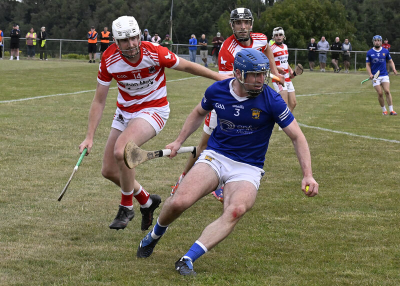 Ballinhassig's Charlie Grainger clears away from Courcey Rovers' Richard Sweeetnam during the Co-Op Superstores SAHC game in Kilbrittain. Picture: Martin Walsh.