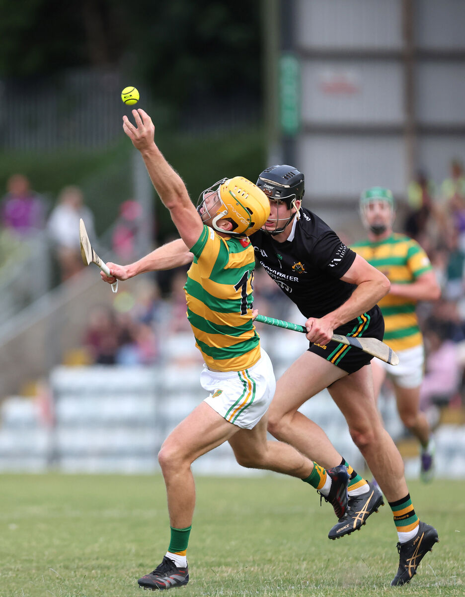 Michael O'Halloran, Blackrock, reaches for the sliotar from Robert Downey, Glen Rovers. Picture: Jim Coughlan.