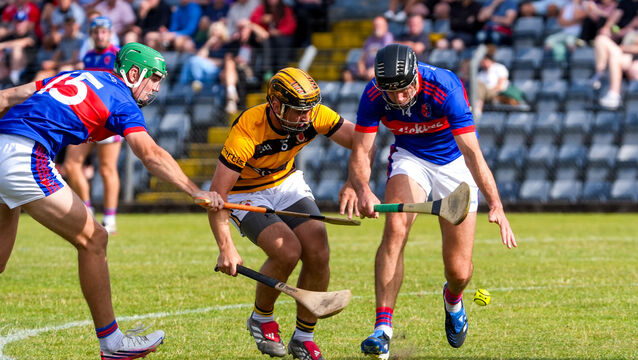 <p>Na Piarsaigh’s Cian Buckley and Erin's Own’s Maurice O’Carroll battle for possession at Páirc Uí Rinn. Picture: Noel Sweeney</p>
