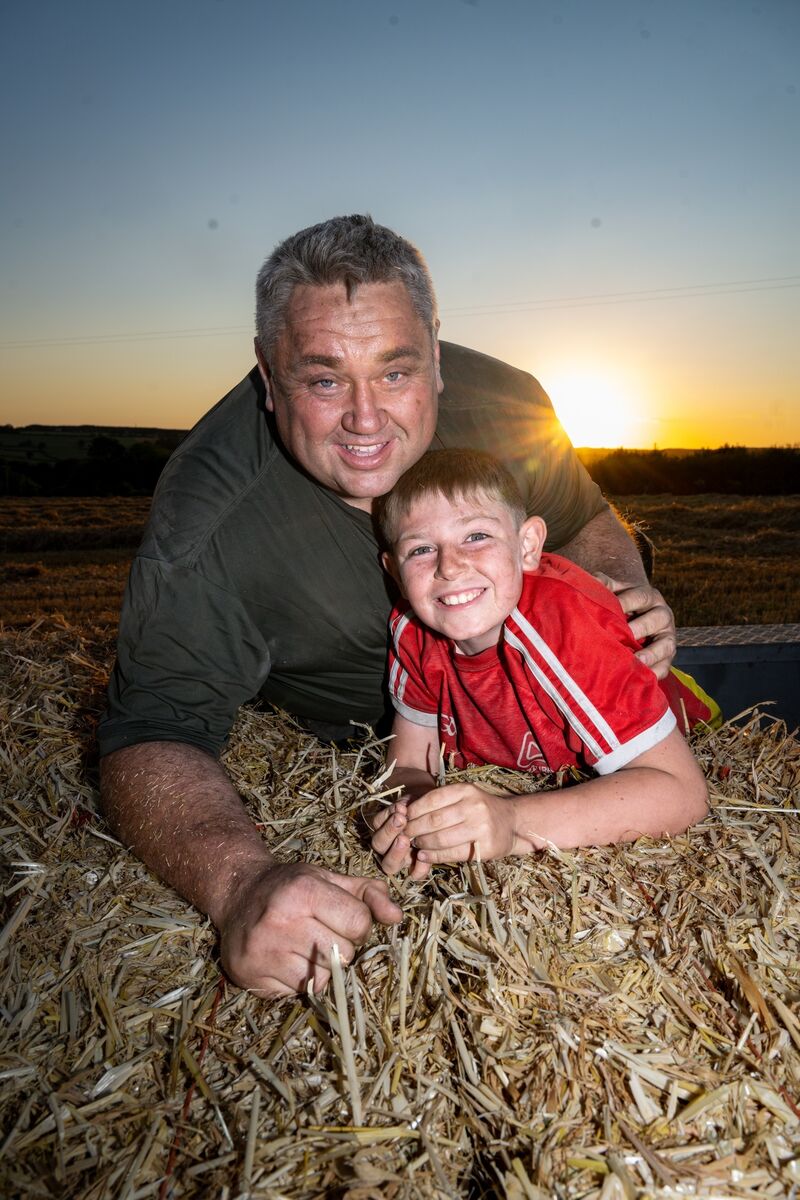 Podge and Jack Dillon pause for a photograph after helping load small hay bales during the annual haymaking evening at Dennis Hickey’s farm near Midleton, Co Cork. Picture: Chani Anderson Podge and Jack Dillon pause for a photograph after helping load small hay bales during the annual haymaking evening at Dennis Hickey’s farm near Midleton, Co Cork. Picture: Chani Anderson