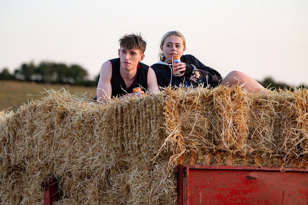 Orlagh Hickey and Fionn Mulcahy take a well-earned rest on top of the stacked hay bales after helping with the annual hay harvest at Dennis Hickey’s farm near Midleton, Co Cork. Picture: Chani Anderson Orlagh Hickey and Fionn Mulcahy take a well-earned rest on top of the stacked hay bales after helping with the annual hay harvest at Dennis Hickey’s farm near Midleton, Co Cork. Picture: Chani Anderson