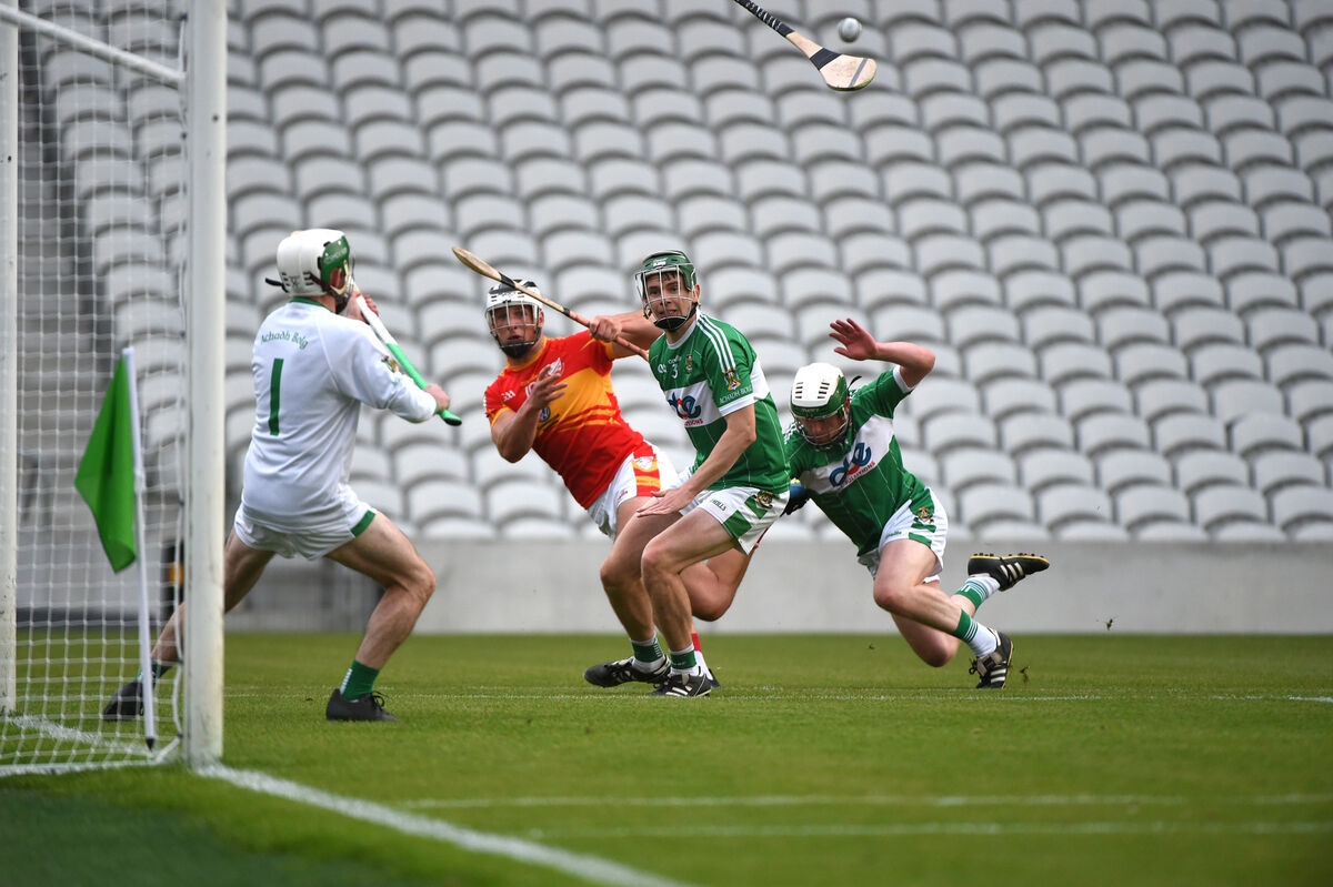 Éire Óg's Colm O'Callaghan makes a pass to Daniel Goulding, who fired in a goal against Aghabullogue in 2021. Picture: Larry Cummins