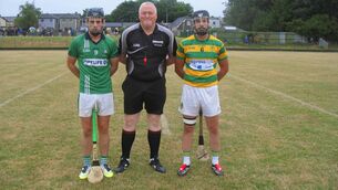 <p>Referee Pat Lyons accompanied by captains Ruairí Quinlan (White's Cross) and Luke Fogarty (Blackrock) </p> <p>Referee Pat Lyons accompanied by captains Ruairí Quinlan (White's Cross) and Luke Fogarty (Blackrock) </p>