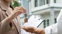 lease, rental and selling home. Real estate agent manager smile holding key for new owner. rent house, Sales, loan credit financ
