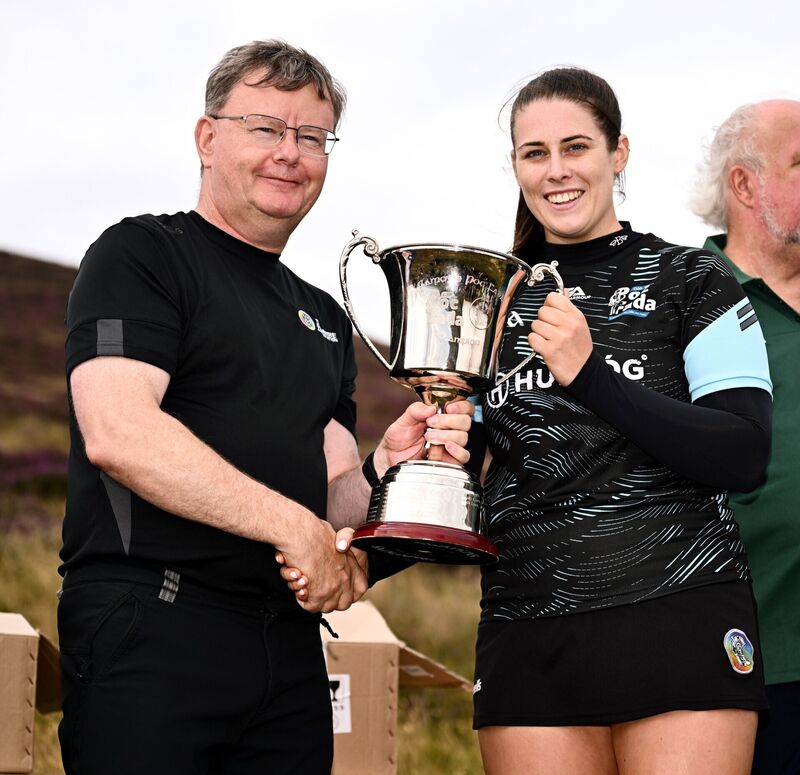 Uachtarán an Cumann Camógaíochta Brian Molloy with senior camogie winner, Molly Lynch, after the M. Donnelly GAA Poc Fada All-Ireland final at Annaverna Mountain in Cooley Peninsula, Louth. Photo by Ben McShane/Sportsfile Uachtarán an Cumann Camógaíochta Brian Molloy with senior camogie winner, Molly Lynch, after the M. Donnelly GAA Poc Fada All-Ireland final at Annaverna Mountain in Cooley Peninsula, Louth. Photo by Ben McShane/Sportsfile