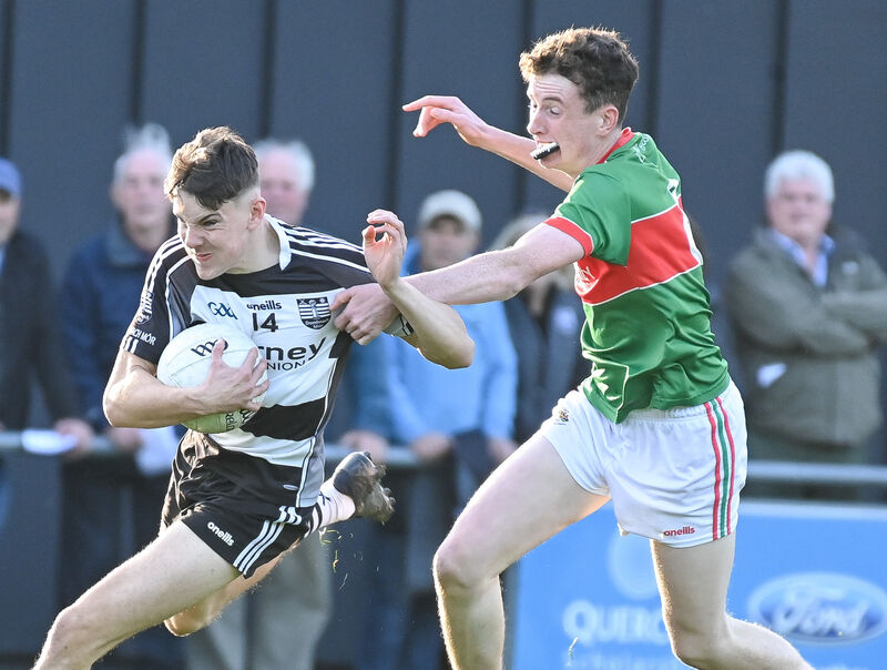 Donoughmore's Daniel Holland races past Clonakilty's David Harte. Picture: David Keane Donoughmore's Daniel Holland races past Clonakilty's David Harte. Picture: David Keane